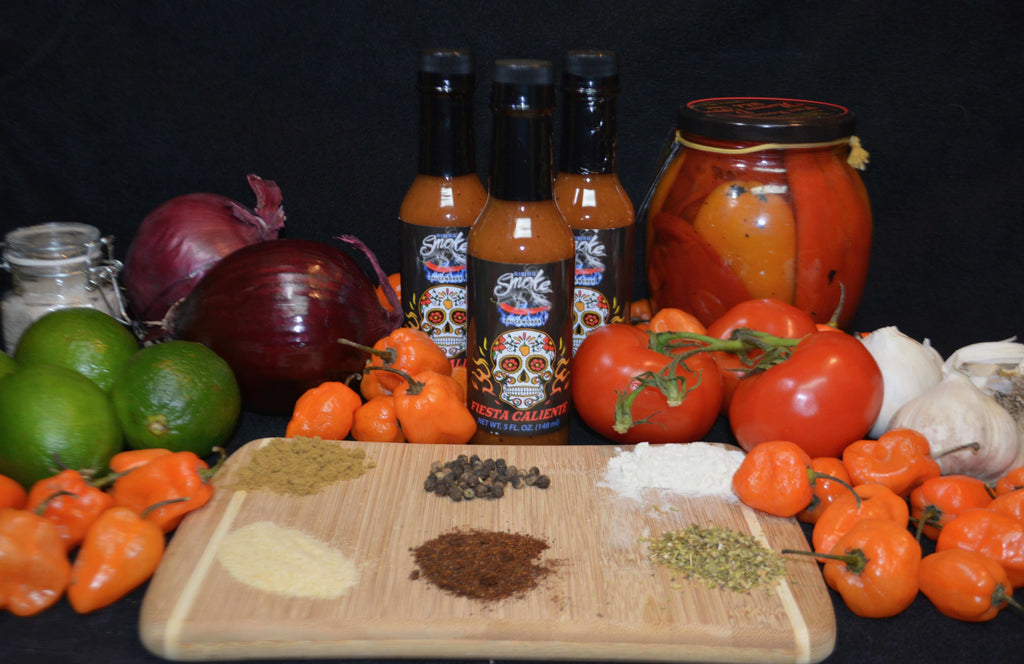 Fiesta Caliente.  Hot smoked habanero taco sauce.  Award winning.  All natural.  Gluten Free.  Vegan.