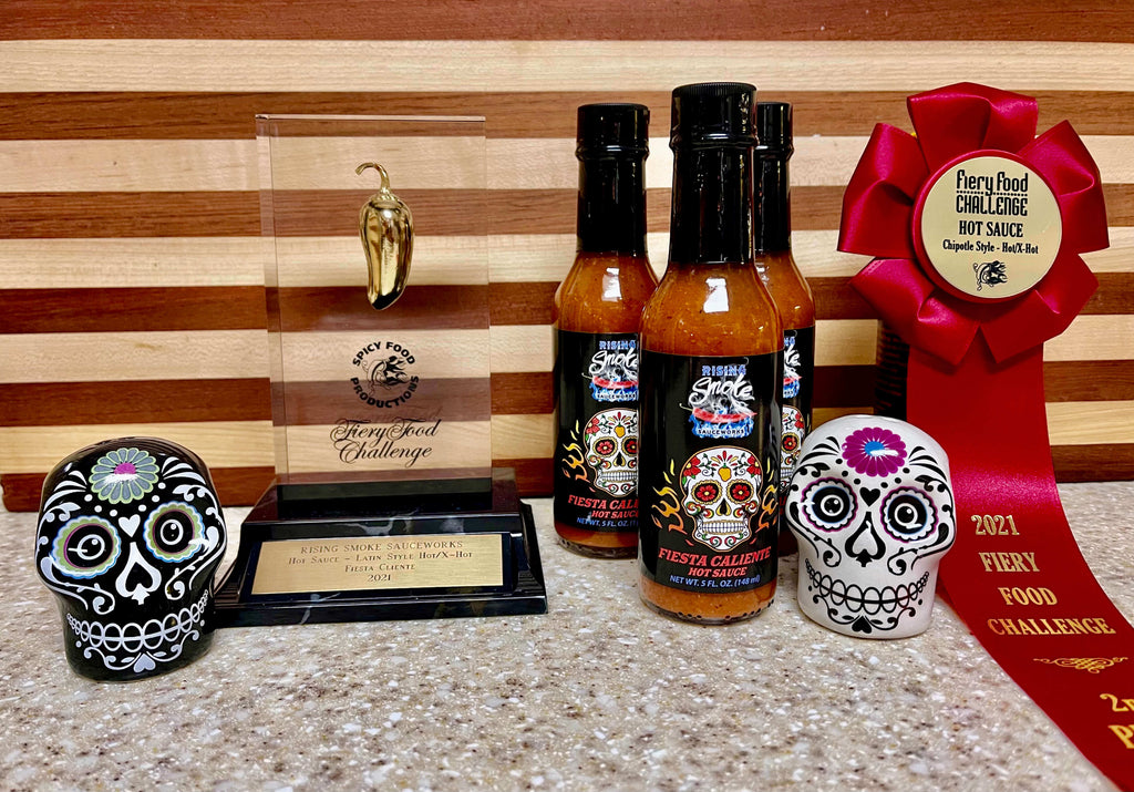 Fiesta Caliente.  Hot smoked habanero taco sauce.  Award winning.  All natural.  Gluten Free.  Vegan.