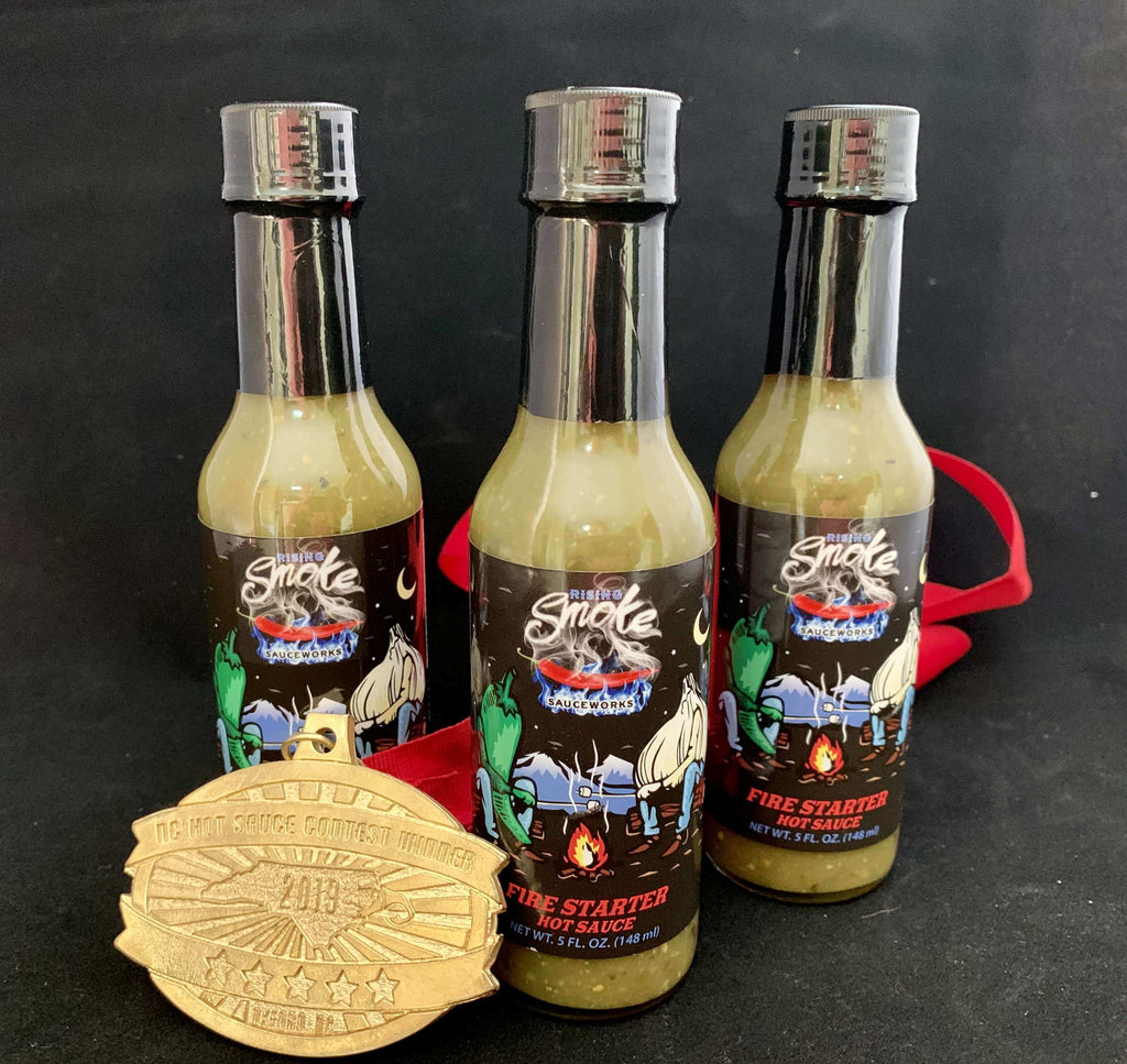 Rising Smoke Sauceworks Fire Starter Hot Sauce.  Roasted jalapeños, garlic, onions and tomatillos.  Multiple award winning.  All natural.  Vegan.  Gluten Free.