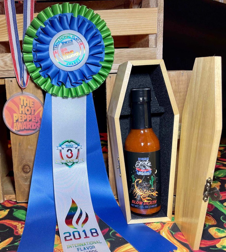 Slow Death hot sauce.  Trinidad scorpion, smoked habaneros, tomato and garlic.  Award winning.  All natural.  Gluten free.  Vegan.